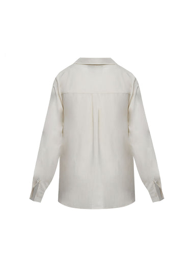 Camisa beige recamada hojas